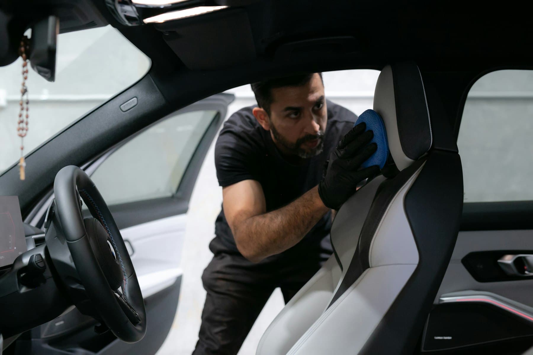 Fabric car seat being shampooed during a mobile car cleaning in Saint John